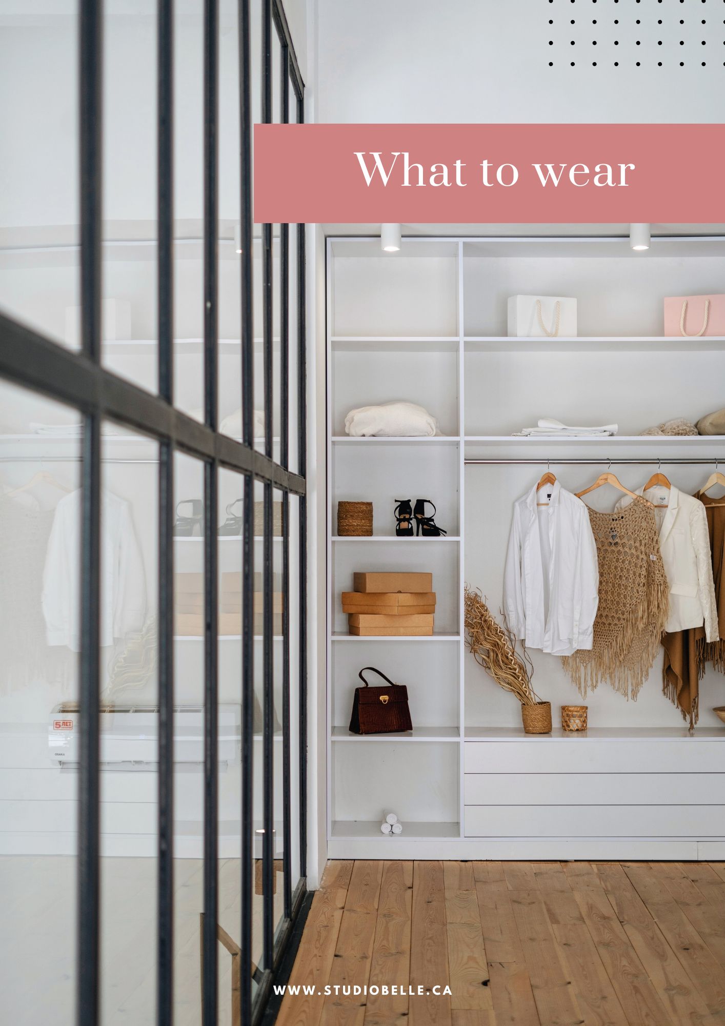Shop display with white shelves, hanging clothes and bags, and a pink 'What to wear' banner across the top.
